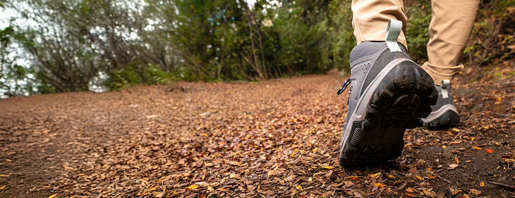 Image of feet walking down an outdoor path